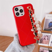 red iPhone case with hand strap