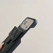 Phone case with a strap on a light gray background