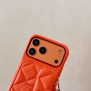 Orange quilted phone case with a beige background