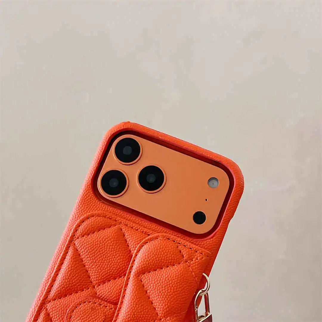 Orange quilted phone case with a beige background