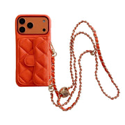 Orange quilted wallet phone case with a chain strap on a white background