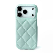 Mint green quilted phone case on a white background