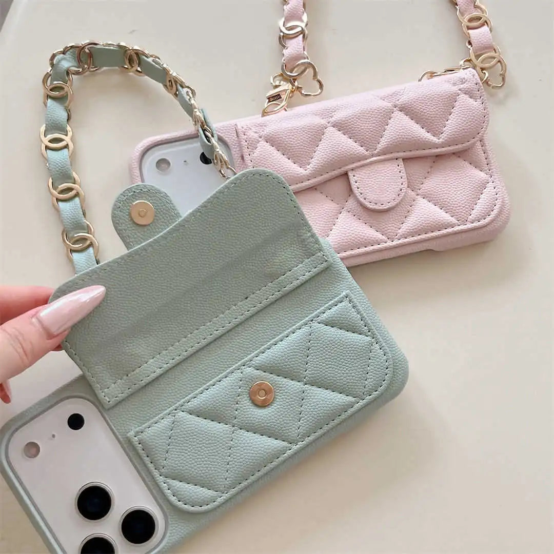 Quilted phone case with card holder and pink crossbody bag on a light background