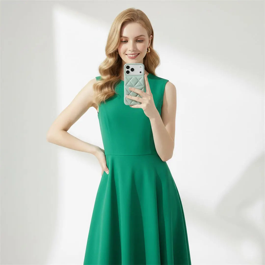 a woman in green dress is taking a selfie
