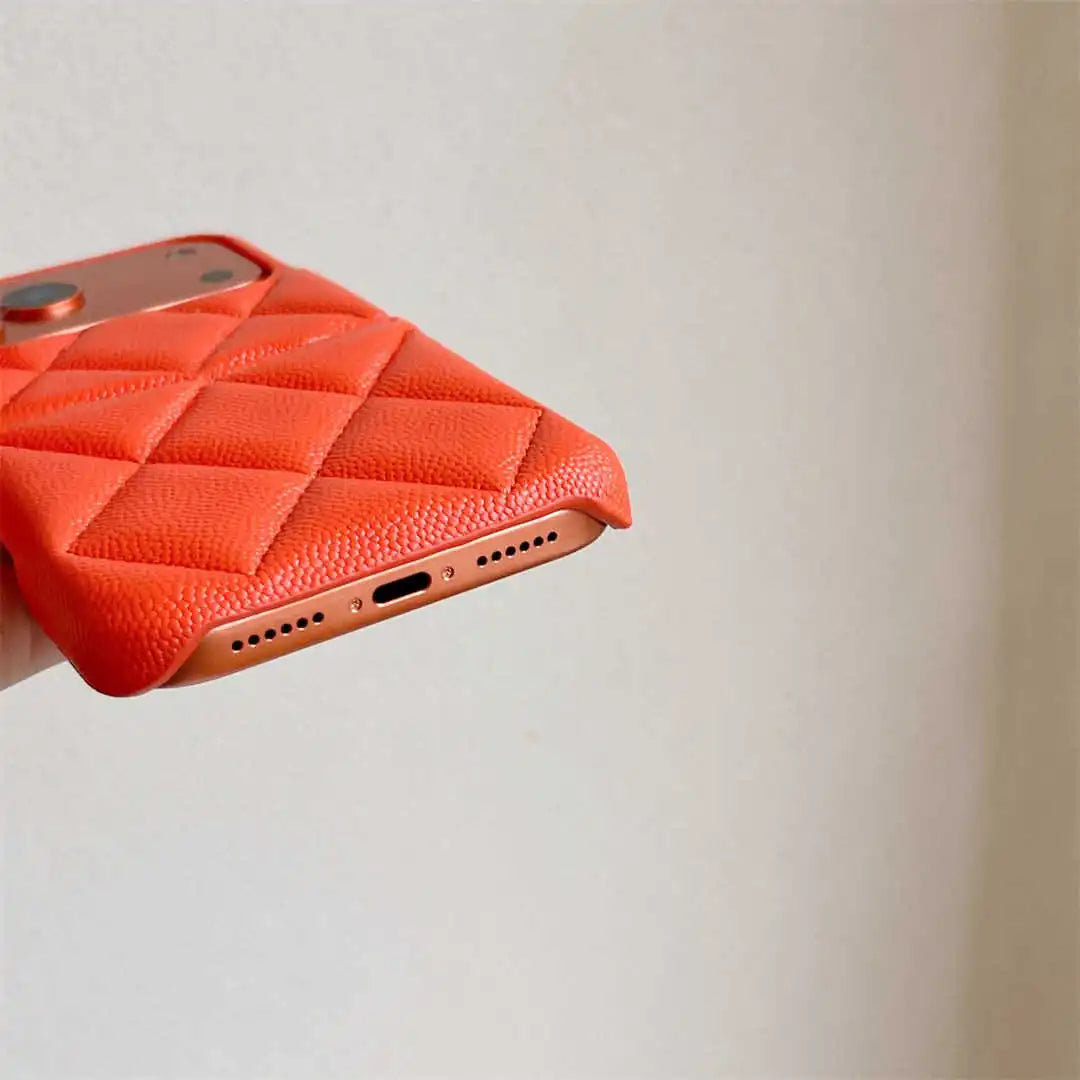 Red textured phone case on a smartphone with a plain background
