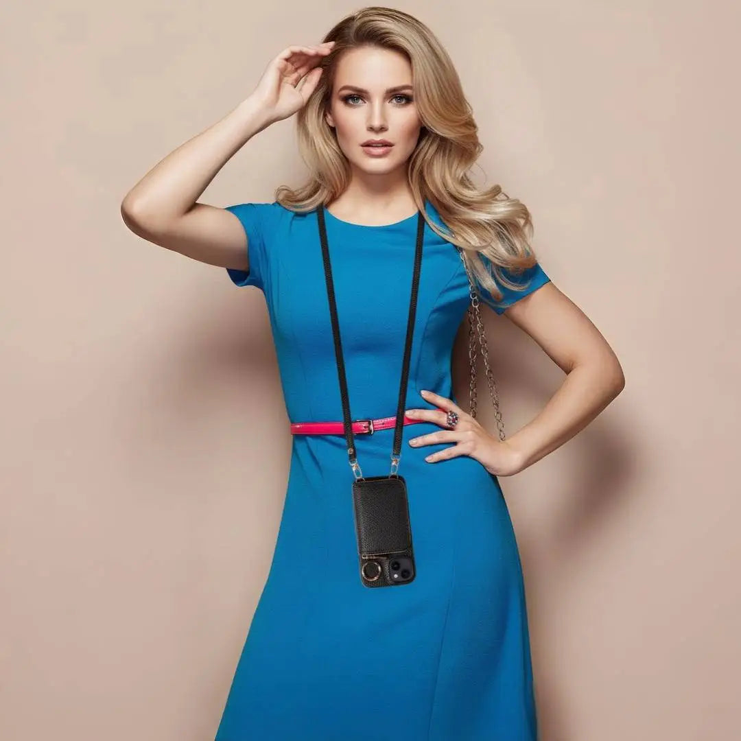 Woman in a blue dress with a black bag against a beige background